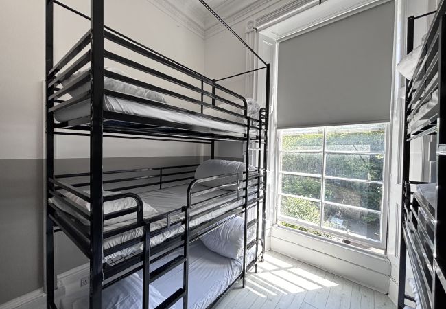 Cozy bunk beds in the 9-person female dorm at Haymarket Hostel, Edinburgh